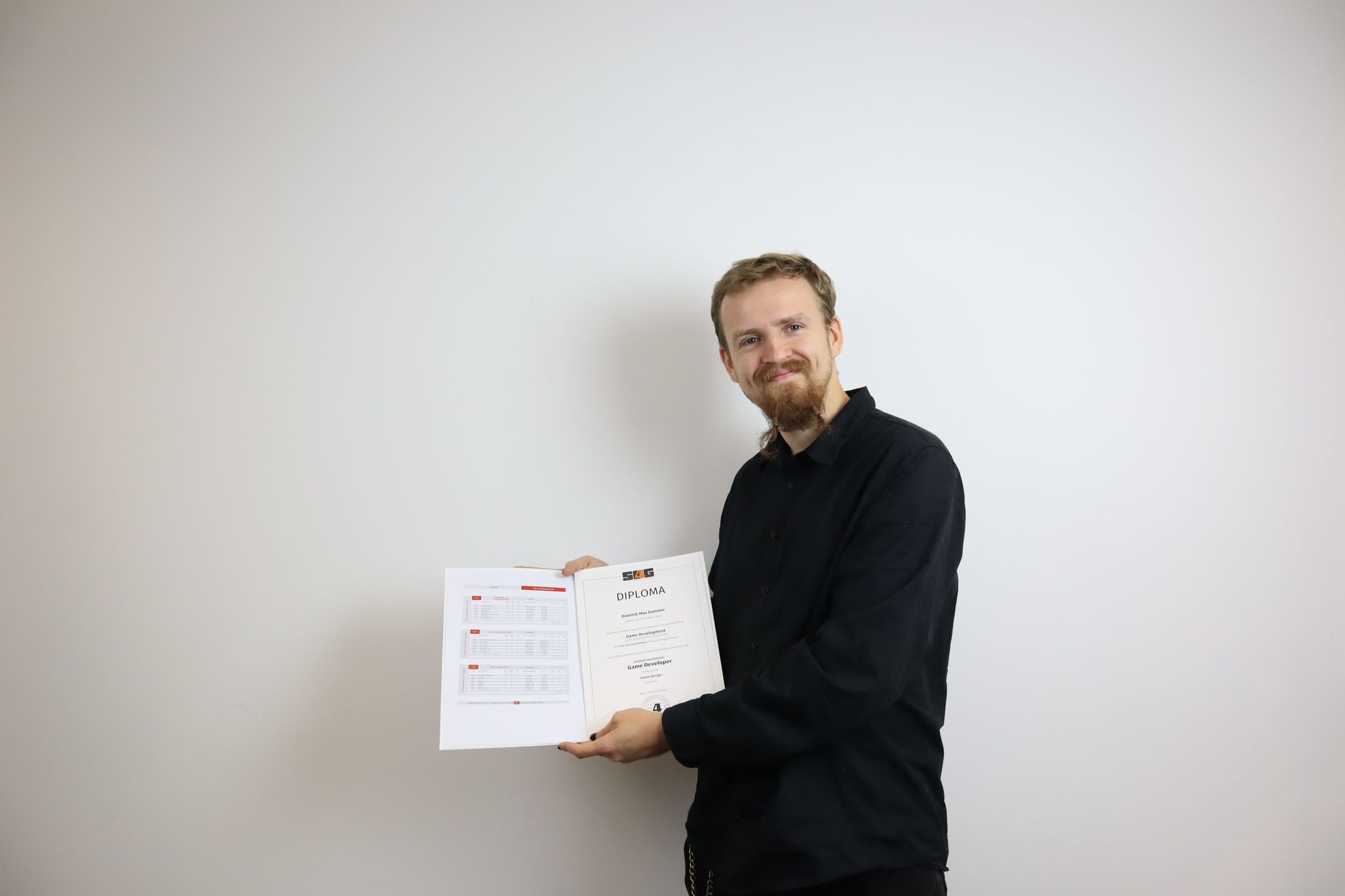 Receiving my Diploma in Game Design from School4Games Berlin