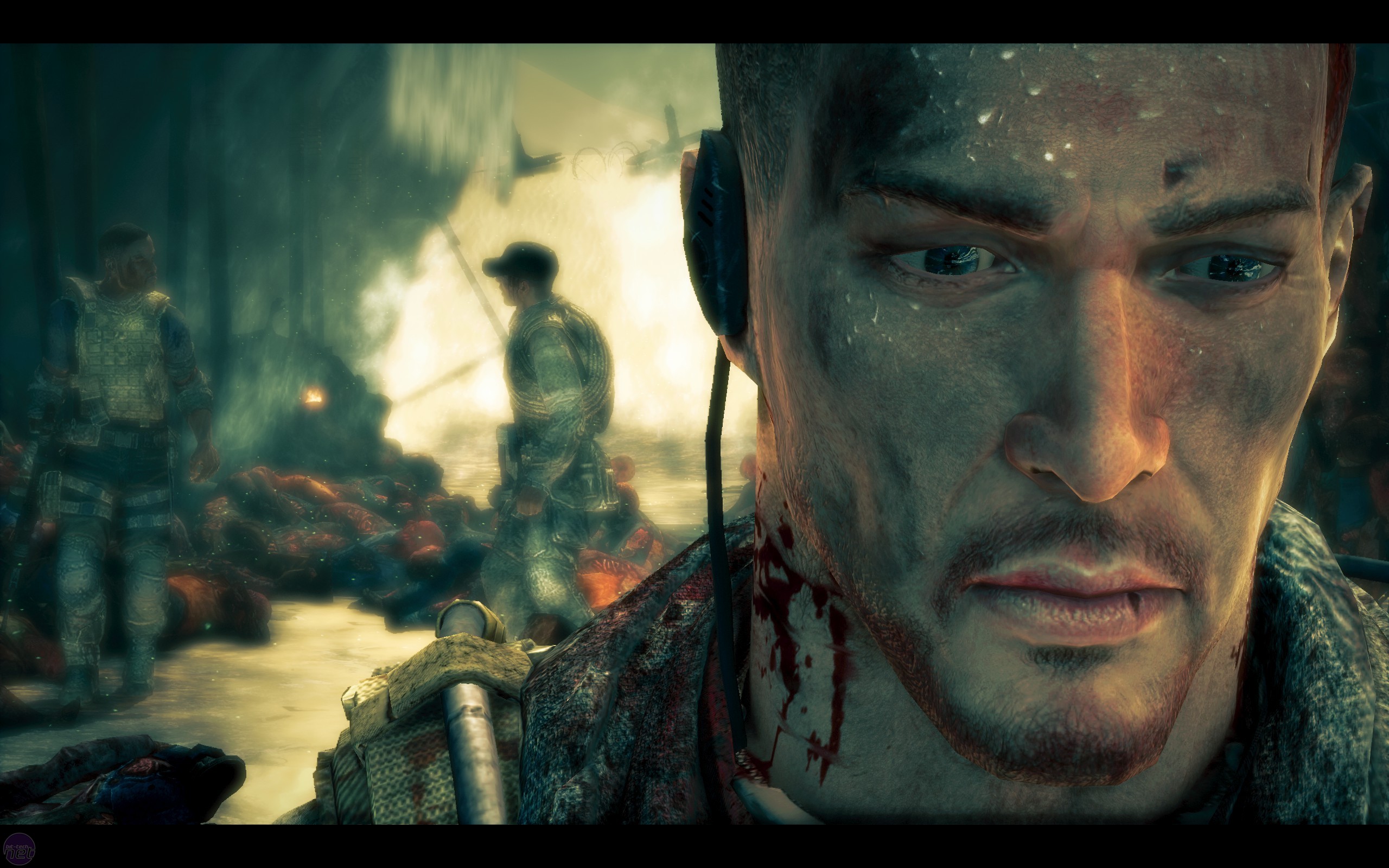 A close-up of a battle-worn soldier, his face filled with anguish, as chaos and devastation unfold behind him. (Spec Ops: The Line)