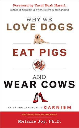 Book Cover "Why we love dogs, eat pigs and wear cows" the cover shows a labrador, bacon, and leather shoes